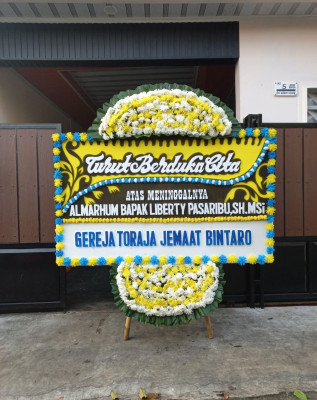 Papan Bunga Duka di Meras